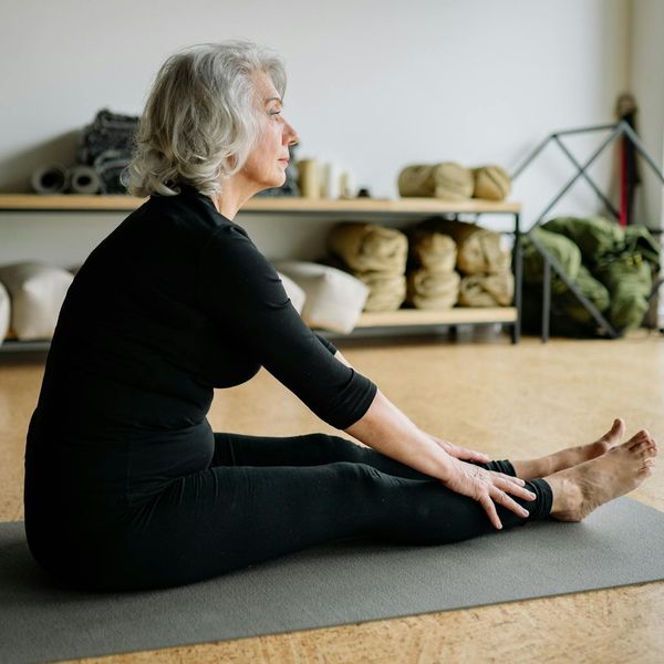 Person stretching gracefully, embodying balance and flexibility.